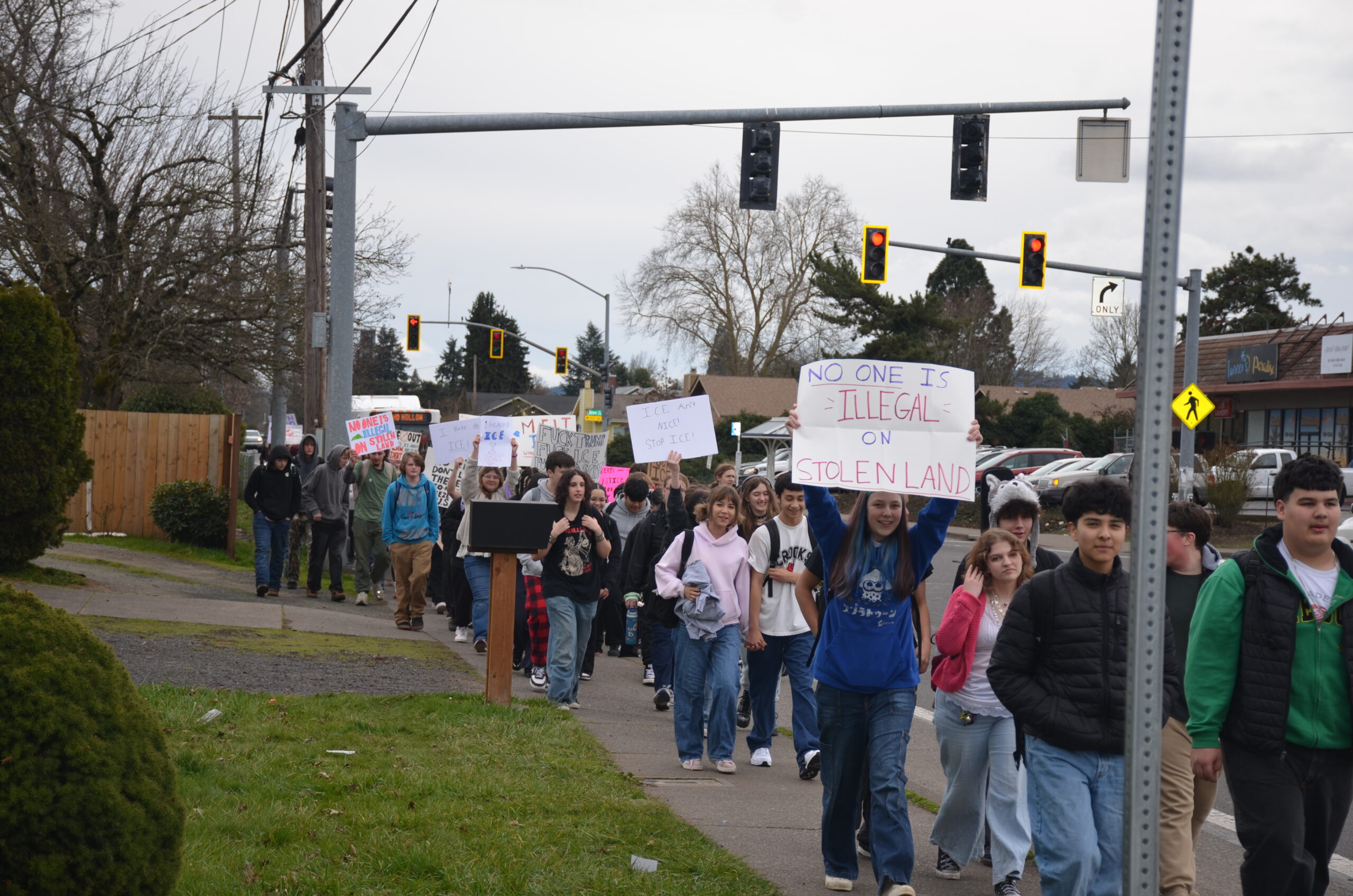 Students walk down Echo Hollow Road on their way to the intersection with Barger Drive